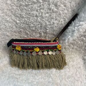 - Elliott Mann Indie multi color clutch with beads and coins accents.
